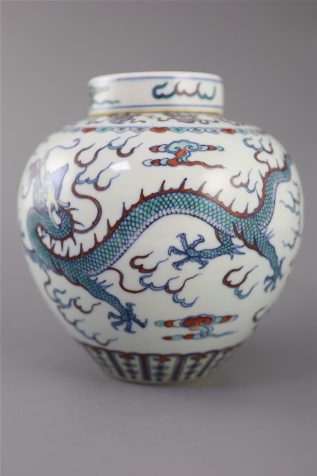 A Chinese doucai dragon jar and cover, Qianlong seal mark, late 19th/early 20th century, 20cm high, neck broken and glued